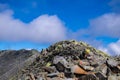 The summit of the Gaustatoppen in norway with a stony path that few dare to climb