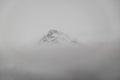 the summit of a mountain shrouded in a blanket of clouds in Reykjavik, Iceland Royalty Free Stock Photo