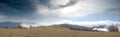 Summit of mountain with view of storm clouds