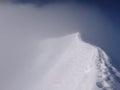 Empty summit ridge of a high alpine peak during bad weather Royalty Free Stock Photo