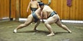 Sumo wrestler fighters tain in sumo stables preparing for sumo tournament held in Tokyo Japan Royalty Free Stock Photo