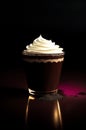 Chocolate cup with whipped cream on a black background.