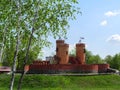 Fabulous medieval brick castle with three towers in the park `Kazka` in Sumy