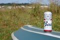 SUMY, UKRAINE - AUGUST 01, 2021: Can of Budweiser Lager Alcohol Beer on overturned kayak boat outdoors. Budweiser is a Brand from Royalty Free Stock Photo