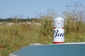 SUMY, UKRAINE - AUGUST 01, 2021: Can of Budweiser Lager Alcohol Beer on overturned kayak boat outdoors. Budweiser is a Brand from Royalty Free Stock Photo