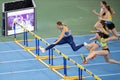 SUMY, UKRAINE - FEBRUARY 22, 2020: champion Anna Plotitsyna on 60m hurdles sprint at Ukrainian indoor track and field championship Royalty Free Stock Photo