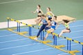 SUMY, UKRAINE - FEBRUARY 22, 2020: falsestart on 60m hurdles sprint at Ukrainian indoor track and field championship Royalty Free Stock Photo
