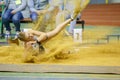 SUMY, UKRAINE - FEBRUARY 9, 2018: Hanna Nelepa performing long jump attempt in pentathlon competition on Ukrainian Royalty Free Stock Photo