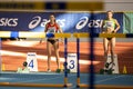 SUMY, UKRAINE - FEBRUARY 21, 2020: Pentathlon athletes on hurdles sprint at Ukrainian indoor track and field Royalty Free Stock Photo