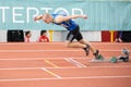 SUMY, UKRAINE - FEBRUARY 21, 2020: sportsman at the start of 200m race at Ukrainian indoor track and field championship