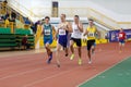 SUMY, UKRAINE - FEBRUARY 17, 2017: sportsmen running qualification race in the men`s 400m running in an indoor track and Royalty Free Stock Photo