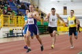 SUMY, UKRAINE - FEBRUARY 17, 2017: sportsmen running qualification race in the men`s 400m running in an indoor track and Royalty Free Stock Photo