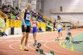 SUMY, UKRAINE - FEBRUARY 21, 2020: sportsmen at the start of 400m race at Ukrainian indoor track and field championship