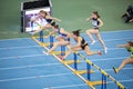 SUMY, UKRAINE - FEBRUARY 22, 2020: sportswomen on 60m hurdles sprint at Ukrainian indoor track and field championship Royalty Free Stock Photo