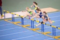 SUMY, UKRAINE - FEBRUARY 22, 2020: sportswomen on 60m hurdles sprint at Ukrainian indoor track and field championship 2020 Royalty Free Stock Photo