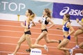 SUMY, UKRAINE - FEBRUARY 21, 2020: sportswomen running 3000m race at Ukrainian indoor track and field championship 2020