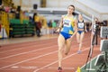 SUMY, UKRAINE - FEBRUARY 22, 2020: sportswomen running 4x400m relay at Ukrainian indoor track and field championship