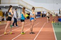 SUMY, UKRAINE - FEBRUARY 22, 2020: sportswomen running 4x400m relay at Ukrainian indoor track and field championship