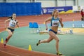 SUMY, UKRAINE - FEBRUARY 17, 2017: Viktoria Grynko #129 and Yulia Shulyar #1218 compete in the women`s 400m running