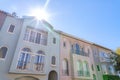 Sun above the row of mediterranean adjacent houses at San Francisco, California