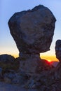 Sun appearing between megalithic monument, Montanchez, Spain