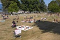 Sun bathers on the grass at Kitsilano beach or `Kits` beach in Vancouver