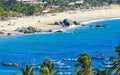 Sun beach sand surfer waves palms in Puerto Escondido Mexico