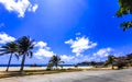 Sun beach sand surfer waves palms in Puerto Escondido Mexico