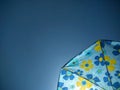 Sun beach umbrella in blue sky background