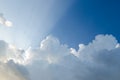 Sun beams through clouds with blue sky Royalty Free Stock Photo