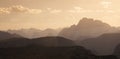 Sun beams over mountain layers during sunset at the Three Peaks nature reserve, South Tyrol Italy Royalty Free Stock Photo