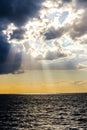 Sun beams through stormy clouds Royalty Free Stock Photo