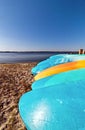 The sun beats down the colorful kayaks made of fiberglass - Assateague, MD, USA