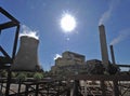 The sun beats down on the powerstation using coal to produce energy.