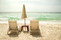 Sun bed Parasol Umbrella on sand beach at coast Royalty Free Stock Photo