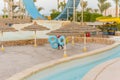 Sun beds in popular tropical paradise deep turquoise mediterranean sandy beach. Umbrellas on the beach o Sea in a beautiful summer Royalty Free Stock Photo