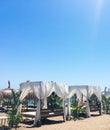 Sun beds on sandy beach coast, luxury Mediterranean resort as travel destination