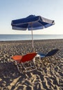 Sun beds and umbrella on the beach Royalty Free Stock Photo