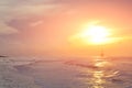 The sun began to rise from the sea in the morning. Royalty Free Stock Photo