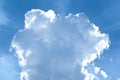 Sun behind a big white cloud on a blue sky Royalty Free Stock Photo