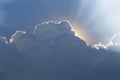 Sun behind clouds creating god rays Royalty Free Stock Photo