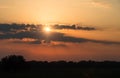 Sun behind clouds sunset , natural background Royalty Free Stock Photo