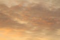 Sun below the horizon and clouds in the fiery dramatic orange sky at sunset or dawn backlit by the sun. Place for text and design Royalty Free Stock Photo