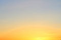Sun below the horizon and fiery dramatic orange sky at sunset or dawn backlit by the sun. Place for text and design Royalty Free Stock Photo