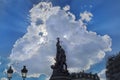 A cloudburst behind the sculpture in place de Clichy