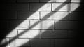 A sun-bleached white brick wall, brightened by sunlight, reveals shadows accentuating its textured surface Royalty Free Stock Photo