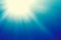 Sun on a blue sky with rays and flare, abstract background Royalty Free Stock Photo