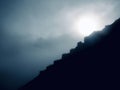 the sun breaking through the mountain mist Royalty Free Stock Photo