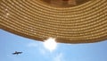 The sun breaks through the straw hat Royalty Free Stock Photo