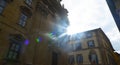 The sun between buildings in Florence Italy
